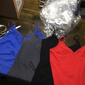 Four old navy tanks. Black grey red and blue S